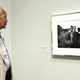 Julian Bond looks at a picture of himself with SNCC in 1963 (Getty Images)